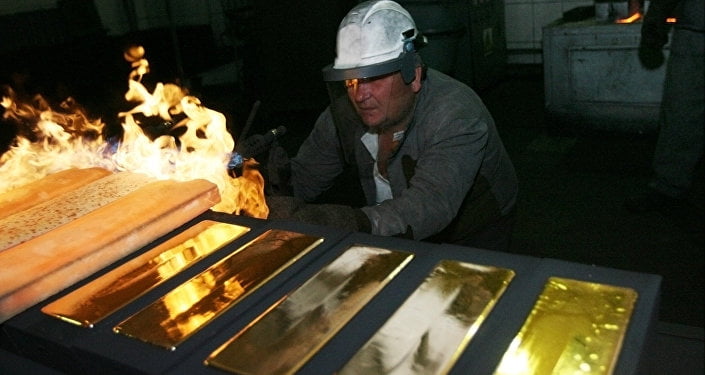 Standard 24 karat gold bars being cast in the foundry of the Novosibirsk gold refinery